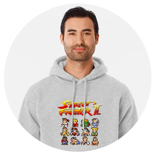 Photo ronde d'un homme qui porte un sweat gris clair Street-Fighter de face avec des personnages en pixels